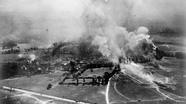 Confined to narrow country lanes, fleeing German convoys were easy pickings for Allied warplanes. Here smoke and flames arise as Allied rockets and bombs hammer German escape routes.