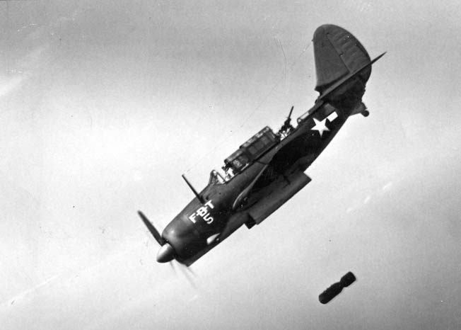 This U.S. Navy Curtiss SB2C Helldiver is releasing its bomb during a training run. Note that both the pilot’s and the gunner’s canopies are open.