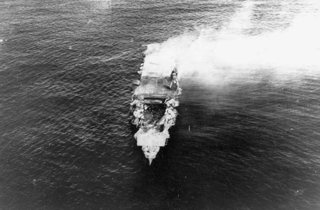In one of the most famous images of the Dauntless from World War II, two SBD-3 dive-bombers from USS Hornet approach the burning Japanese heavy cruiser Mikuma during the early afternoon of June 6, 1942, near the conclusion of the Battle of Midway. Mikuma had been hit earlier by strikes from Hornet and Enterprise, leaving her fatally damaged and dead in the water. This photo was enlarged from a 16mm color motion picture film. 