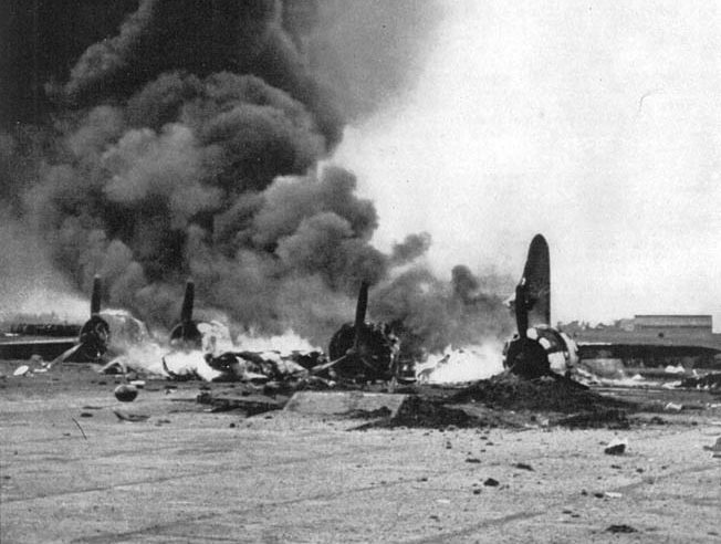 A Boeing B-17 Flying Fortress heavy bomber of the ABDA air forces is consumed by flames in the aftermath of a Japanese air raid on installations at Bandoeng on the island of Java on February 19, 1942. The raid was in preparation for the Japanese invasion of the island, and soon the attackers were in control of the skies.