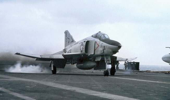 An American RF-4B Phantom II jet lands on the aircraft carrier USS Midway during FLEETEX 83 exercises. 