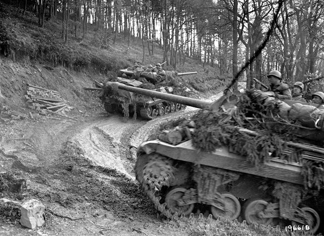 American armored vehicles make their way up a slippery incline in the Hürtgen Forest. The men of the 2nd Ranger Battalion relieved elements of the 5th Armored Division when they arrived at Hill 400. 