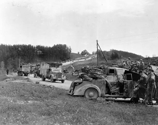 A convoy of surrendering SS troops near Enns, Austria. The 65th Division soldiers showed little compassion for the SS, infamous for committing atrocities. Tulper recalled that the division ordered, “Take no prisoners.”