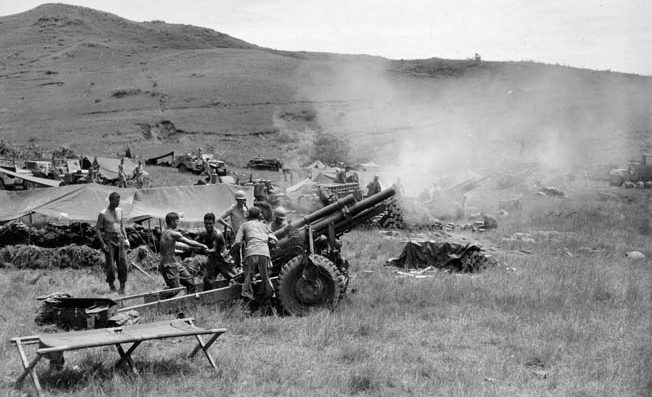 A 105mm artillery battery opens fire on Japanese positions. 