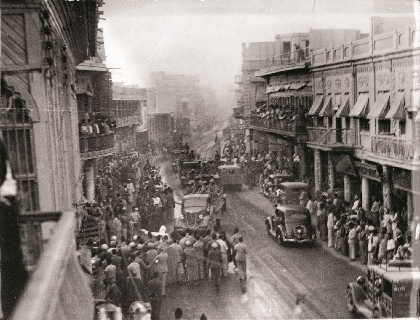 Baghdad at the time of the German-leaning coup. Soldiers are seen riding through the streets in open trucks.