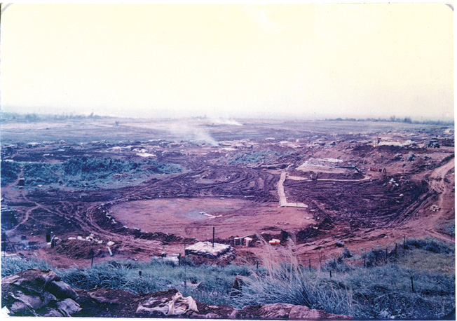 The red clay of Con Thien was clearly visible for miles against the lush green countryside.