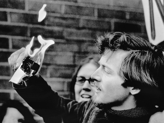 University of Wisconsin Student Goddard C. Graves burns his draft card at the height of the Vietnam War protests.