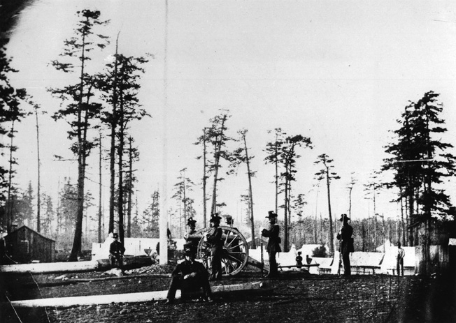 American soldiers man an artillery post on the south end of San Juan Island. A dispute over the boundary between Washington Territory and British Columbia almost led to an armed conflict between the United States and Great Britain in 1859.