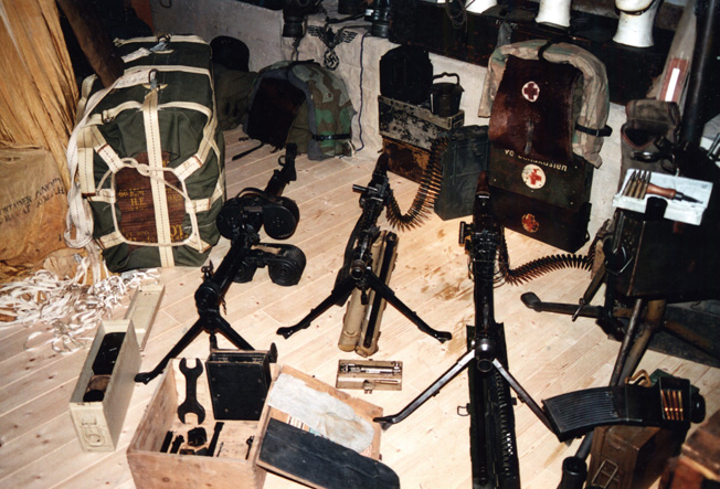 German machine guns, including the fast-firing MG-42 and the MG-15, mounted on a bipod by paratroopers on the ground.
