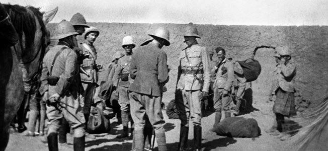 Commanding General H.H. Kitchener, center right, discusses the Battle of Omdurman with Maj. Gen. Sir William Gatacre, in charge of the British Brigade on the Nile.