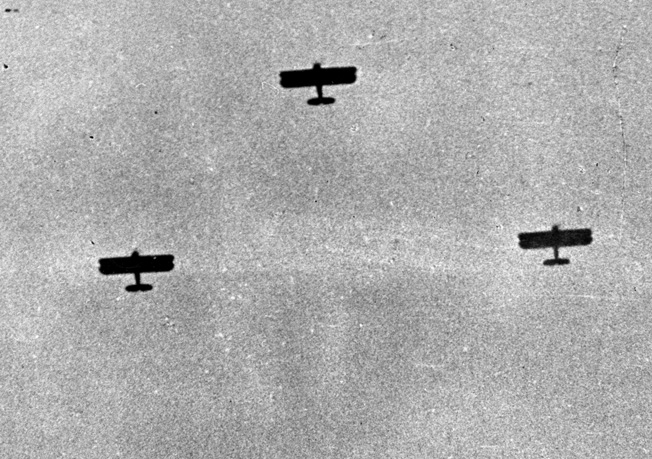 In a photo taken from the window of the New York Times bureau in Shanghai, three Japanese bombers are seen during one of numerous raids on the city.