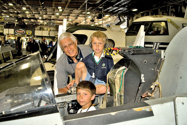 Visitors try out a Soviet MiG simulator.