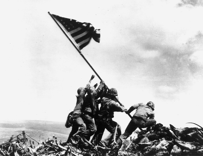 U.S. Marines raise the flag on Iwo Jima in Joe Rosenthal's famous photograph in March 1945.