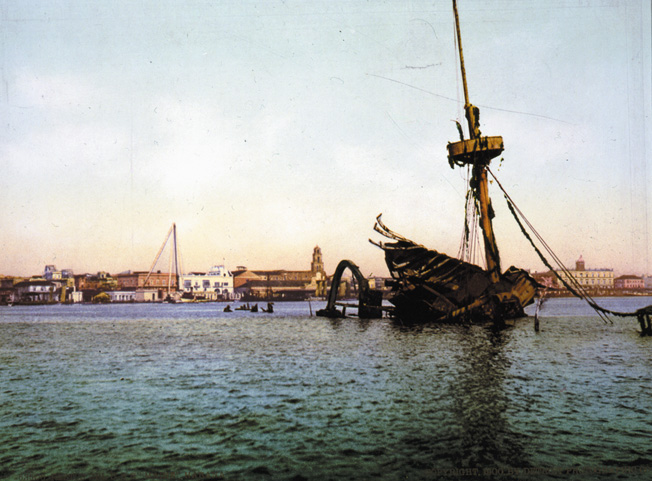 The USS Maine lies scuttled in Havana Harbor in William Henry Jackson's photograph.