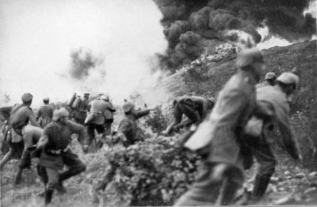 German soldiers throw grenades during a mass infantry assault at Verdun in March 1916.