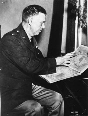 Brigadier General Marshall studies a map while with the 3rd Division, 1936.