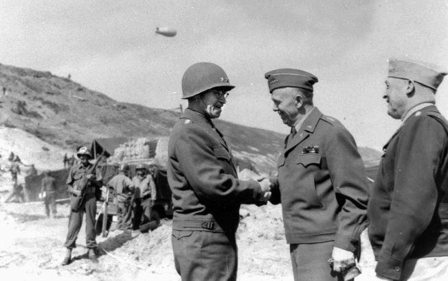 Lieutenant General Omar Bradley greets Marshall in Normandy in June 1944.