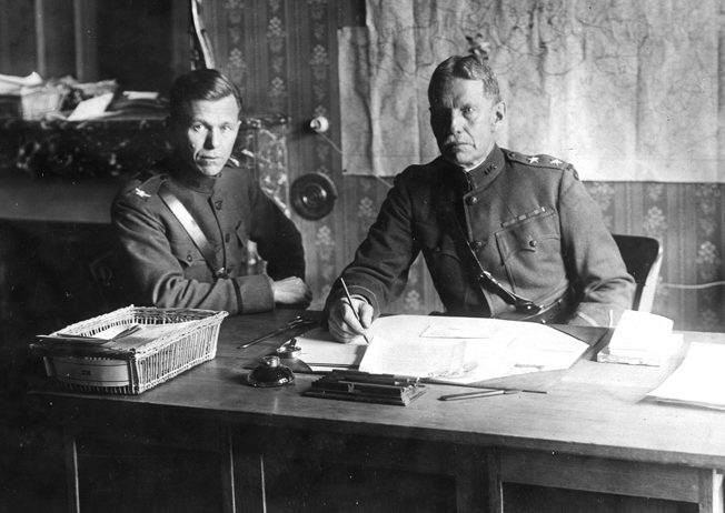 Colonel George C. Marshall converses with Major General Henry T. Allen, commanding general of the 90th Infantry Division, in France, 1918.