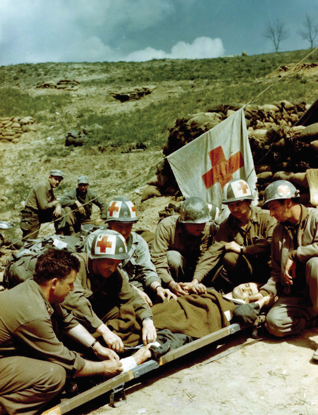 A prisoner is given medical care by medical care by medics of the U.S. 10th Mountain Division near Bologna.
