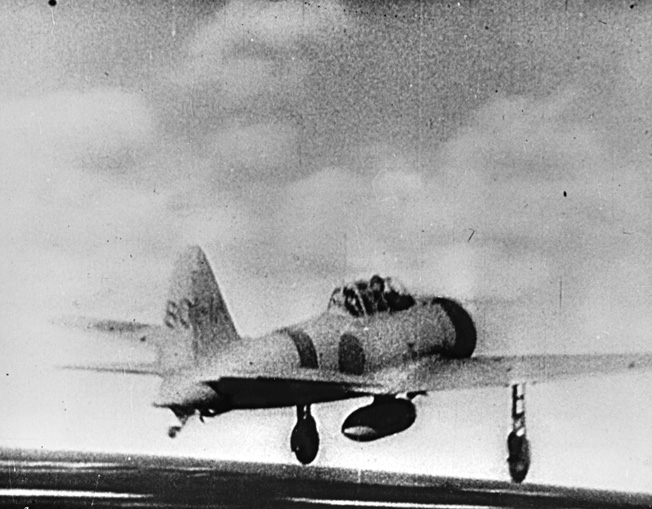 Another still taken from a Japanese newsreel showing a Mitsubishi/Nakajima A6M Zero taking off from an unidentified aircraft carrier.
