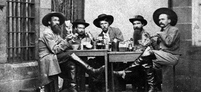 A notably unrepentant group of officers from Morgan’s cavalry share a consoling drink during their imprisonment at Western Penitentiary in Allegheny City, Pennsylvania. Morgan and six others escaped from prison in Columbus, Ohio.