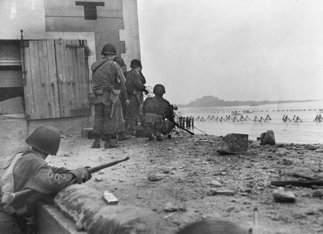 American soldiers in St. Malo fire on Germans in the Citadel. By the time Sheffloe’s company reached Dinard, the Germans had abandoned it for St. Malo.