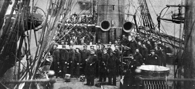 Highly disciplined and well turned out, the crew of USS Kearsarge poses for a photograph at their battle stations in 1864, the year they did battle with the famous Confederate raider CSS Alabama off the coast of France.