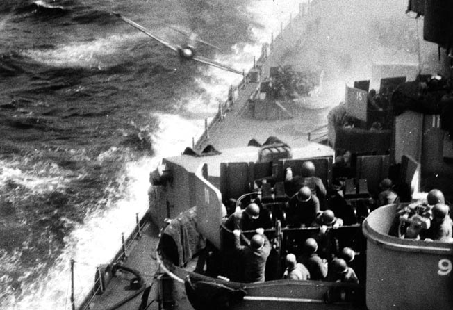 Sailors at their starboard aft battle stations aboard the USS Missouri brace for impact moments before a kamikaze slams into the ship at Okinawa, April 11, 1945. Nearly indestructible, the “Mighty Mo” nevertheless sustained damage and casualties, yet survived to host the surrender ceremonies on September 2, 1945.