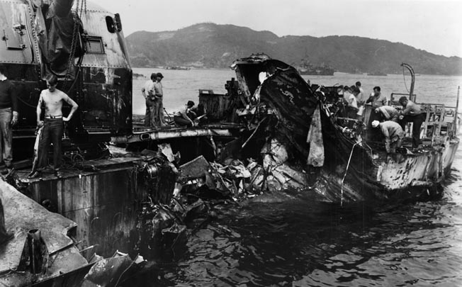 The badly damaged Leutze limps into port, April 9, 1945, after encountering a kamikaze off Iwo Jima. A plane hit the U.S. carrier Hancock, bounced off, and crashed into the Leutze.