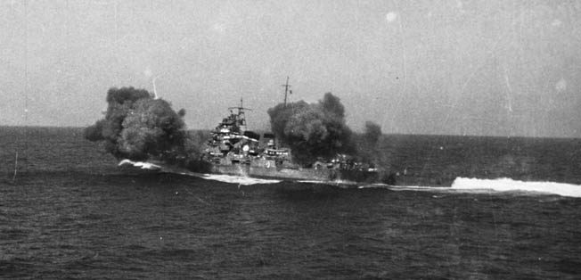 The Japanese cruiser Chokai, flagship of Admiral Gunichi Mikawa at Savo Island, fires a salvo during exercises before the outbreak of war in the Pacific. 