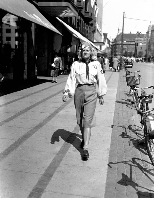 A member of Denmark’s Nazi Youth organization, part of the National Socialist Workers’ Party, the country’s largest Nazi organization, walks proudly down a Copenhagen street, June 1941.