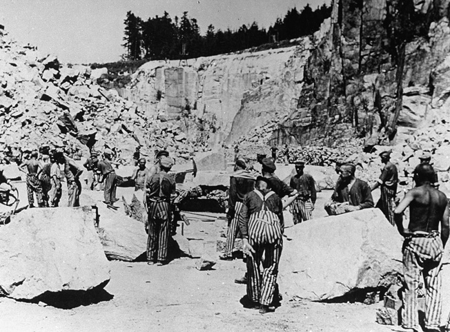 Jewish prisoners working as slave laborers in the deadly confines of the Mauthausen concentration camp quarry.