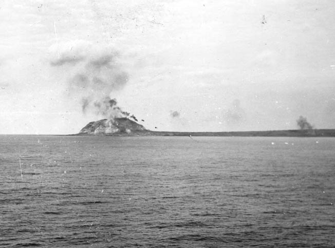 Mount Suribachi is blasted by shellfire from Nevada’s 14-inch guns, February 1945.