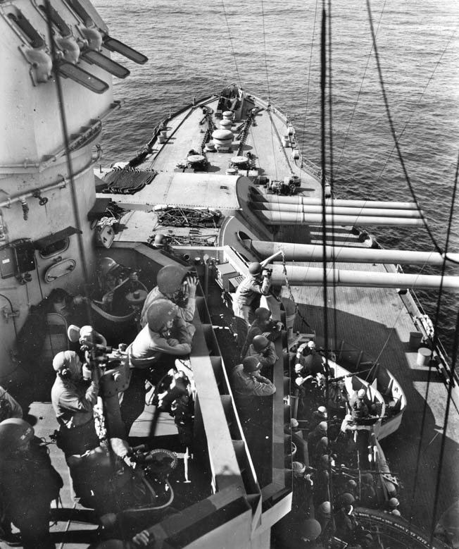 With binoculars in hand, crews are on the alert for the enemy. Nevada participated in Operation Landcrab—the retaking of Attu Island in the Aleutian chain, April 1943.