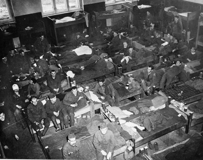 American, British, Canadian, and French POWs await liberation in a German POW camp in Faulkenau, Czechoslovakia. 