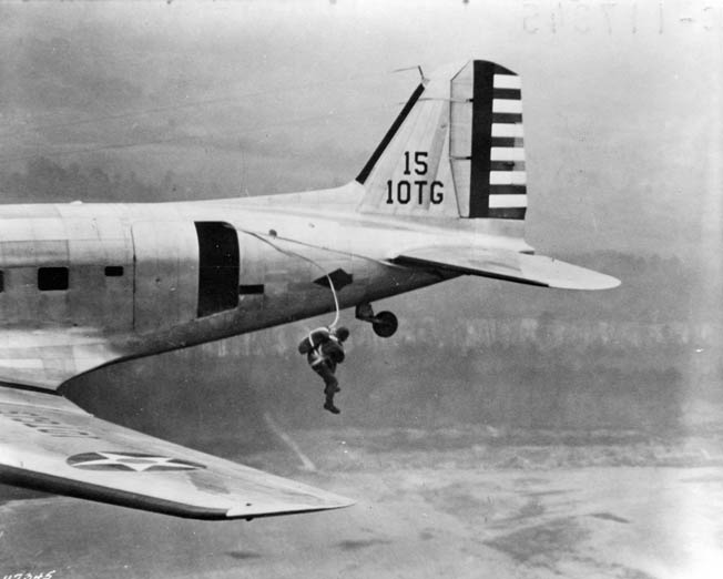 A paratrooper at Fort Benning, Georgia, makes a practice jump from a C-47 Skytrain. Nobles once dropped a roll of toilet paper before he jumped so Bette could identify him.