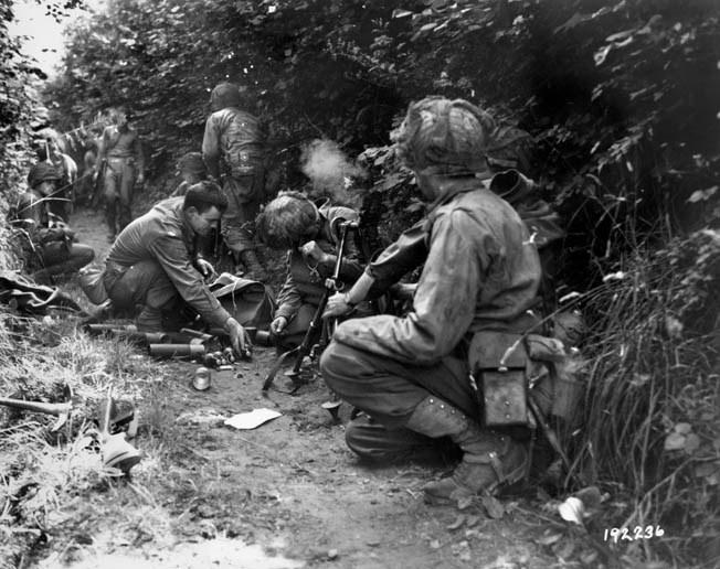 An American mortar team fires at the enemy from their hedgerow position. By swiftly adapting to the changing battlefield, American soldiers became a formidable fighting force by the end of the war.