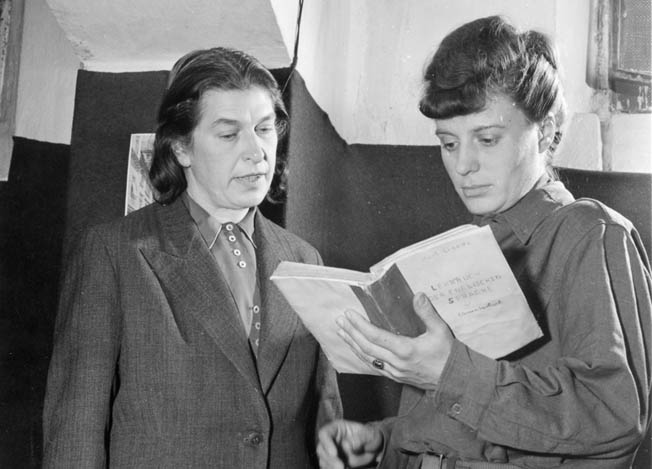 Johanna Wolf, one of Adolf Hitler’s secretaries, confers with Ingeberg Bremen, a secretary to one-time Deputy Führer Rudolf Hess during a break in courtroom proceedings at Nuremberg.