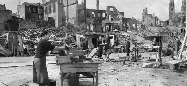 During the months and even years following World War II, German civilians, such as these seen gathering anything of potential value along a destroyed boulevard, were forced to endure privations never before experienced by the German people.