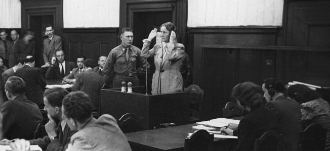 Emmy Göring, widow of Luftwaffe Chief Hermann Göring, who committed suicide to cheat the gallows at Nuremberg, testifies during the war crimes trial of Paul Koerner, who had been an associate of her late husband.