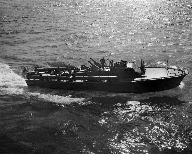 An American PT-boat demonstrates its speed in open water in 1943. PT-boats were the first American surface units to engage the Japanese ships moving through Surigao Strait toward the landing beaches at Leyte. 