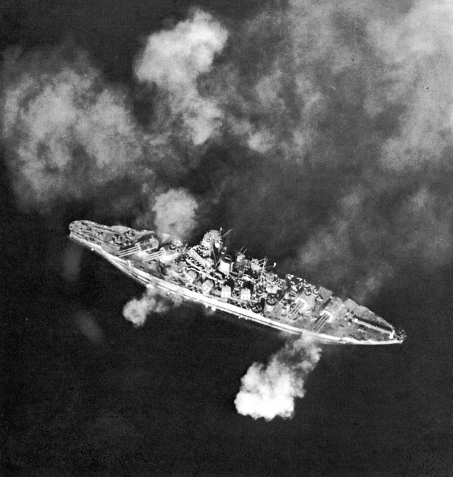 The battleship USS Pennsylvania fires its guns during shore bombardment in the Pacific. Pennsylvania was present in drydock during the Pearl Harbor attack and sustained damage that was later repaired. Unable to acquire a radar lock, the battleship did not fire a shot during the Battle of Surigao Strait.
