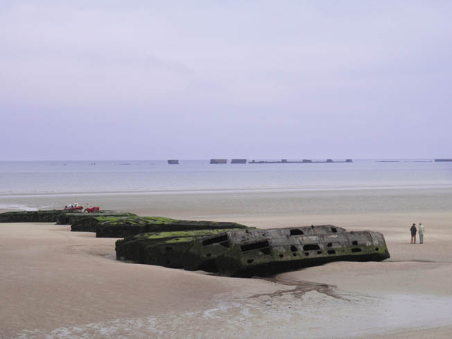 The remains of “Mulberry B” can be visited at low tide at Gold Beach right outside the Musée du Débarquement (D-Day Invasion Museum) at Arromanches-les-Bains. 