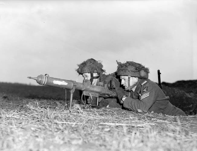 Two troopers of the 1st Canadian Parachute Battalion fire their PIAT antitank weapon at oncoming enemy armored vehicles near the town of Lembeck, Germany, in March 1945. Within weeks, World War II in Europe was over.