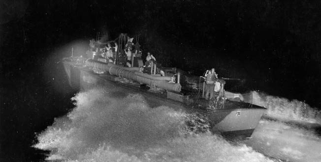 A PT boat crew goes through final shakedown during night training exercises in 1943. The boats were powered by three Packard V-12 engines that gave them a top speed of 65 mph.