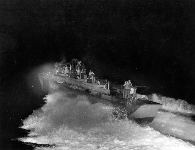 A PT boat crew goes through final shakedown during night training exercises in 1943. The boats were powered by three Packard V-12 engines that gave them a top speed of 65 mph.