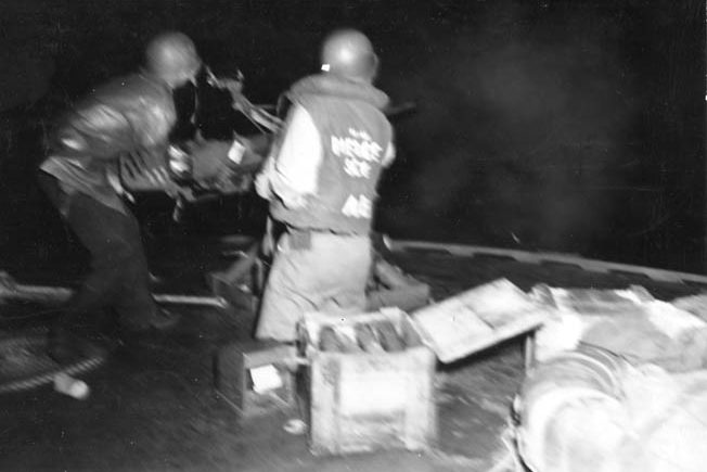 The gun crew on a PT boat fires one of its Oerlikon 20mm autocannons against Japanese-infested waters off New Guinea in November 1943. Note how reverberations shake the gunner’s body. 