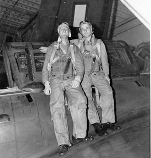 Posing on the hangar deck of the aircraft carrier USS Hancock (CV 19) to which they transferred after being aboard USS Ticonderoga (CV 14) are SB2C pilot Bill Klenk (left) and radioman-gunner Bill Hall. 