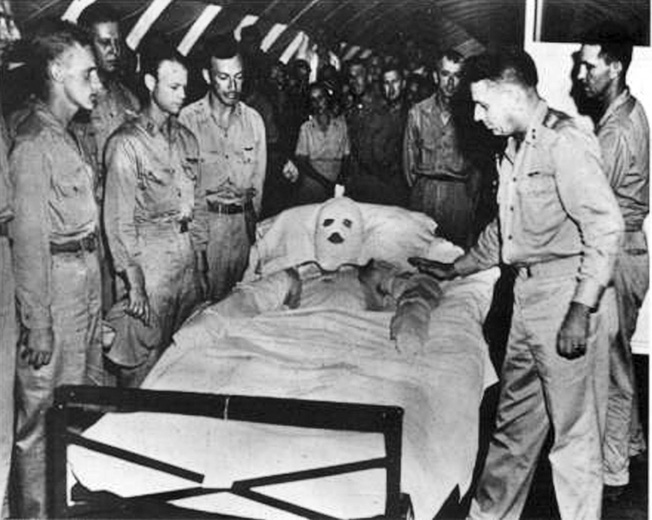 The Snatch Blatch/The City of Los Angeles B-29 crew gathers with Maj. Gen. Willis Hale to honor the terribly burned Staff Sergeant Henry E. “Red” Erwin.