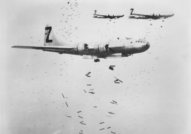 Other cities were also targeted. Following up on the Tokyo raid, B-29s from 500th Bomb Group, 73rd Bomb Wing, drop incendiary bombs—dubbed “Molotov flower baskets”—on Yokohama, near Tokyo, May 1945. 
